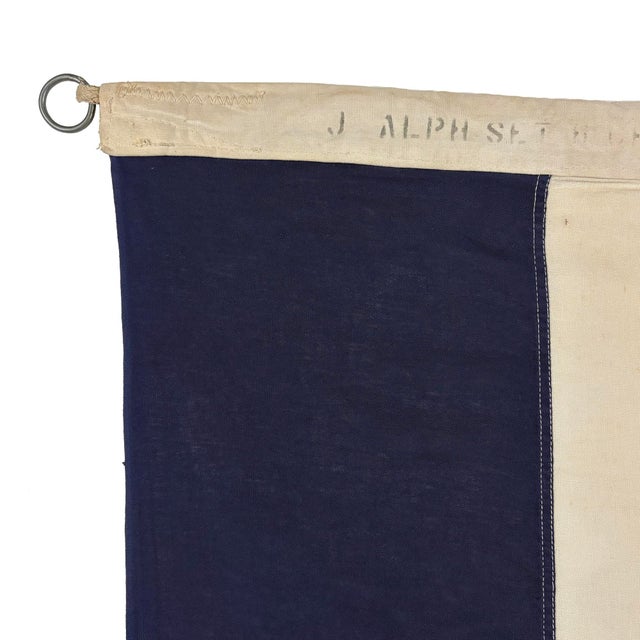 This vintage signal flag is fully sewn from a cotton cloth in navy blue and off-white. Please note staining and other wear...
