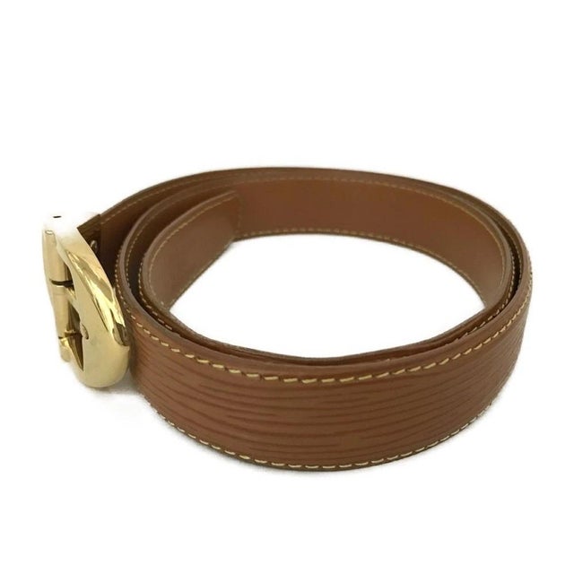 Authentic Louis Vuitton Epi Ceinture Brown Leather Belt. Comes with a Legit Grails Certificate of Authenticity. Features a...