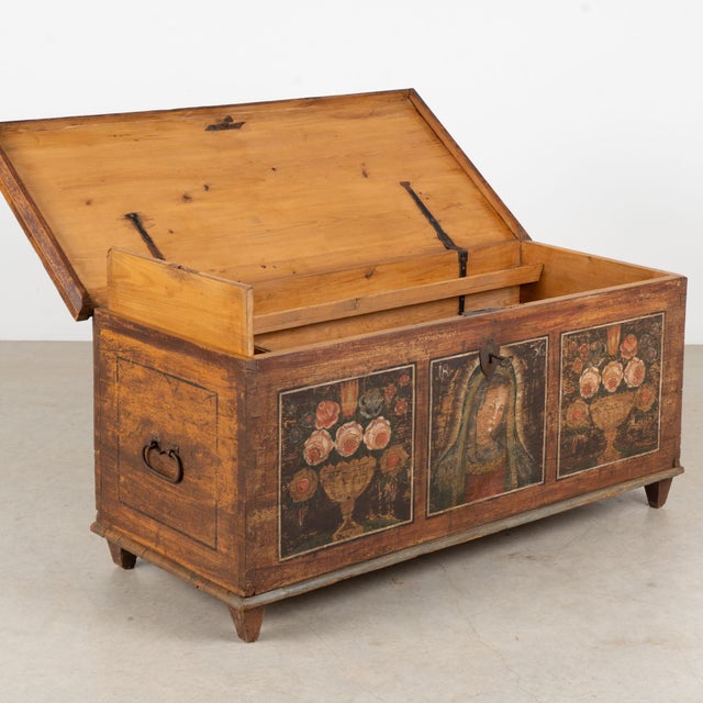 Austrian flat-top pine trunk dated 1836, retaining its original hand-painted folk art decoration and a beautifully aged...