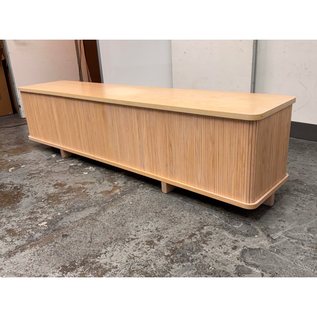Design Plus Gallery presents a Tambour Credenza from EQ3. This streamlined credenza showcases vertical tambour detailing...