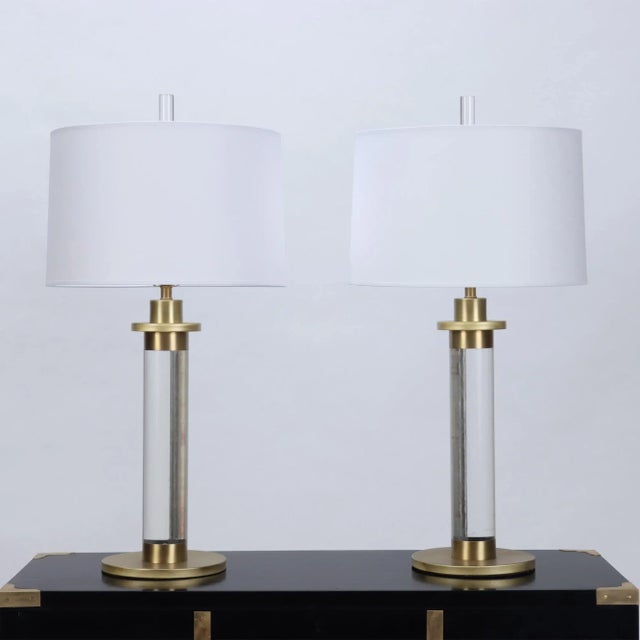 A pair of Lucite and Brass Column Table Lamps. Brass re-finished and newly re-wired. Circa 1950. Base: 8.5"Dia Lamp...