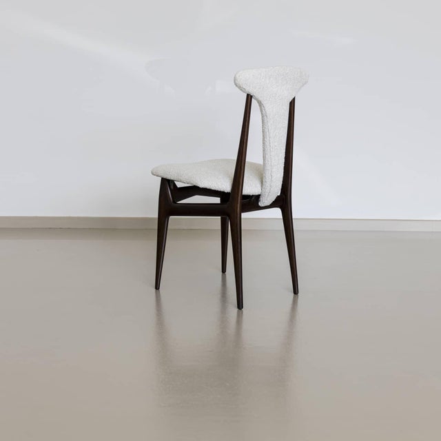Set of four Italian mid-century side chairs with T-shaped backrests and elegant, smooth wooden frames with an interesting...