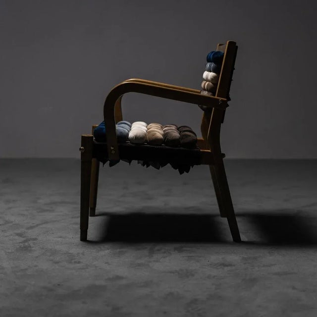 Pair of 70s balls chairs. Wooden structure. Seat and back handmade balls coated in velvet with chromatic scale. Gold metal...