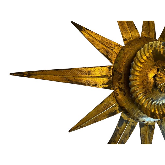 1960s Oliver Messel, Mid-Century gold gilt metal Sunburst ceiling light on a pendant stem is rare and beautiful.