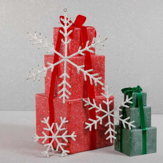 Add sparkle and texture to your seasonal décor with this set of 12 snowflake ornaments, crafted from iron and hand-strung...