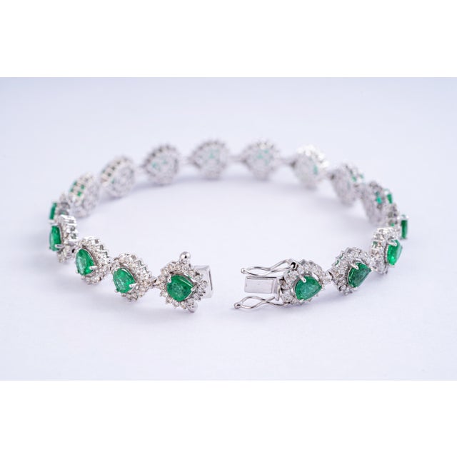 This is an awesome natural Zambian bracelet which has very high quality emeralds and very good quality diamonds which are...