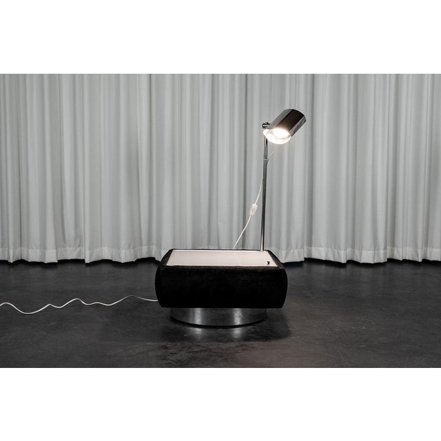 Set of two side tables consisting of a black Alcantara box on chrome base, a retractable white melanin top and a chrome...