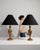 Pair of brass urn table lamps in Antique Brass. Finished in antique brass, this pair of brass urn table lamps is...