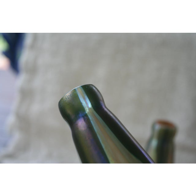 A pair of Steven Lundberg Studios Iridescent Magnolia/ Water Lilly Glass Shades. Both are etched "Lundberg Studios 1981"...