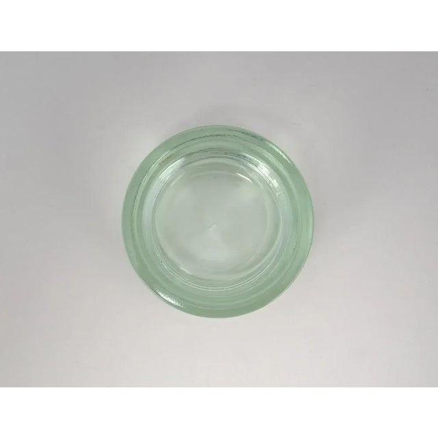 An impressive testament to early glass artistry: this solidly crafted bowl captivates with its archaic rigor and heavy,...