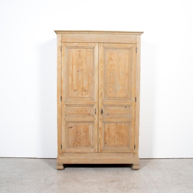 A handsome mid-19th century French Louis Philippe period armoire from Provence, handcrafted of solid pine and bleached to...