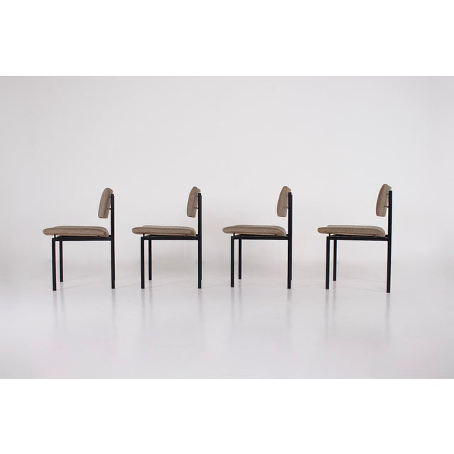 Four minimalist modernist chairs, designed by eugen schmidt soloform, late 1950s. a robust black lacquered steel frame...
