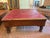 A timeless blend of classic campaign style and rustic craftsmanship, this vintage trunk-style coffee table features a...