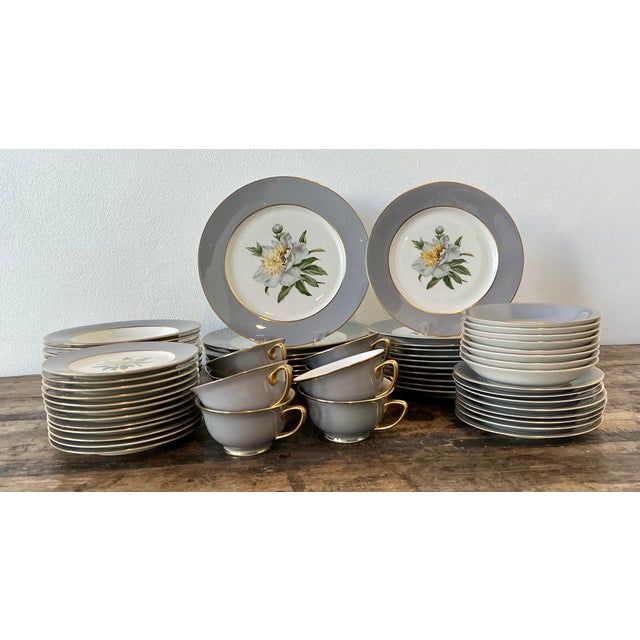 This magnificent 72-piece dinnerware service from Princess China is a masterclass in Mid-Century Modern elegance,...