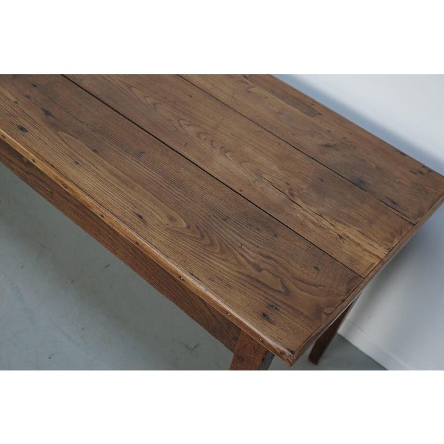This elegant table was made in France in the late 19th century. The table was made in solid elm with beautiful grain...