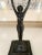 A wonderful carved bronze figure holding a cup above her head - a stand alone sculpture for any room. Be creative and use...