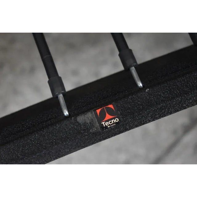 Set of four PS142 armchairs designed in 1966 by Eugenio Gerli and produced by Tecno, Italy. Stands on rubber wheels....