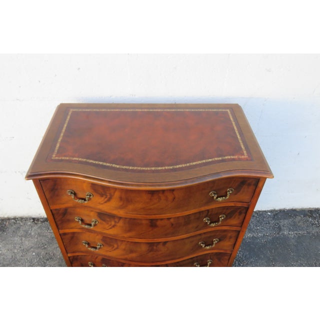 This classic Large Nightstand is made of wood, solid wood, mahogany, flame mahogany, veneer, and metal. The Dresser was...