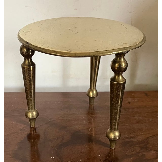 Antique 19th century English Victorian small scale brass three legged table trivet or candle riser stand. Quality...