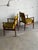 This exceptional pair of seating pieces showcases an elegant low-profile frame with sculpted armrests and a gently angled...