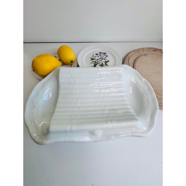 Made of French ironstone (Terre de fer) this is a solid and heavyweight piece. The vegetable gets placed in the center and...