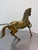 An impressive find for collectors: This large horse, crafted from solid brass, brings the majestic power and dynamism of...