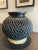 A beautifully crafted black clay pottery vessel from Oaxaca. Unique to the region, the black clay in extracted from the...