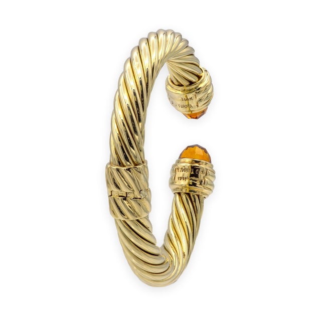 David Yurman Classic Cable hinged cuff bracelet in 14K yellow gold, featuring the brand's signature twisted multi-strand...