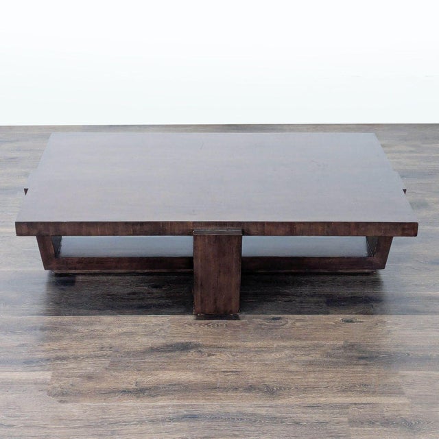 An architectural base supports an elegant cathedral cherry top finished a rich clear mocha with soft gray undertones....