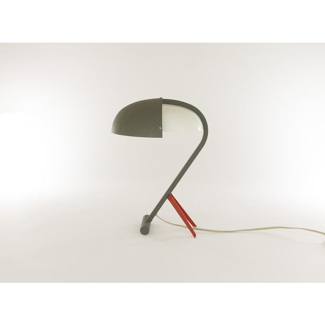 Rare table lamp, Model NX 110, designed by Louis Christiaan Kalff for Philips Eindhoven. It has a grey steel frame; the...