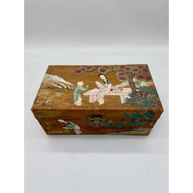 A finely detailed antique Chinese painted pigskin document or jewelry box, likely early 20th century, featuring a charming...