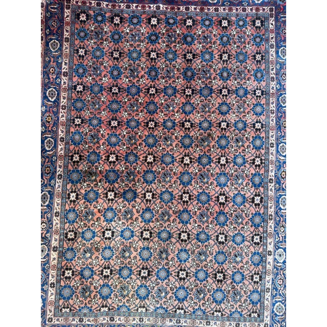 Very beautiful mid century luxurious rug with beautiful designs of the stylized flowers all over the field, on a red pink...