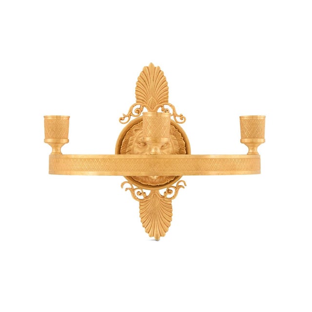 20th century, the backplates in the form of lion's heads mounted with anthemia grasping engine-turned rings, set with...