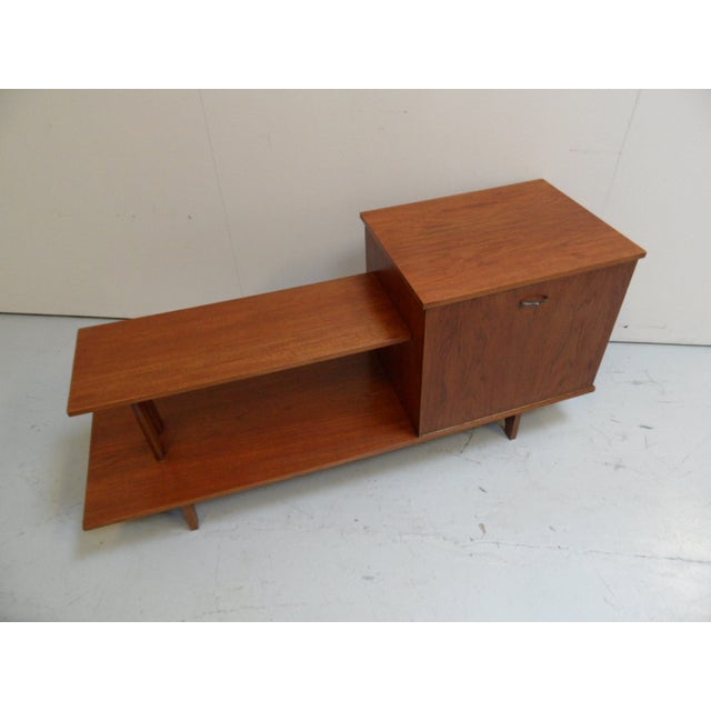 Can be used as sideboard , open bookcase or room divider. The backside is nice too;can be set free in the room.