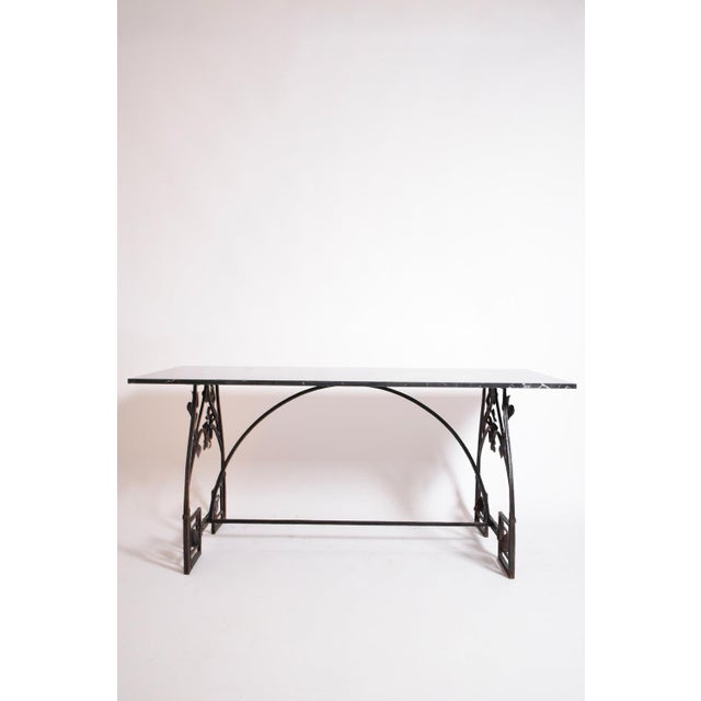 Floral wrought iron console table, 1960s. Floral wrought iron console table, desk or dining table with a black marble...