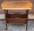 An Early American Style Walnut Magazine Rack Side Table with two large magazine slots measuring 17" wide and 3" in depth....
