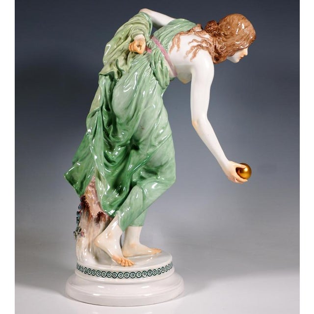 Extremely decorative, fully sculptural representation of an art nouveau beauty in a softly falling robe, tilted forward to...