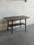 Beautiful vintage Danish Modern coffee table crafted in walnut, featuring elegant tapered legs, softly rounded edges, and...