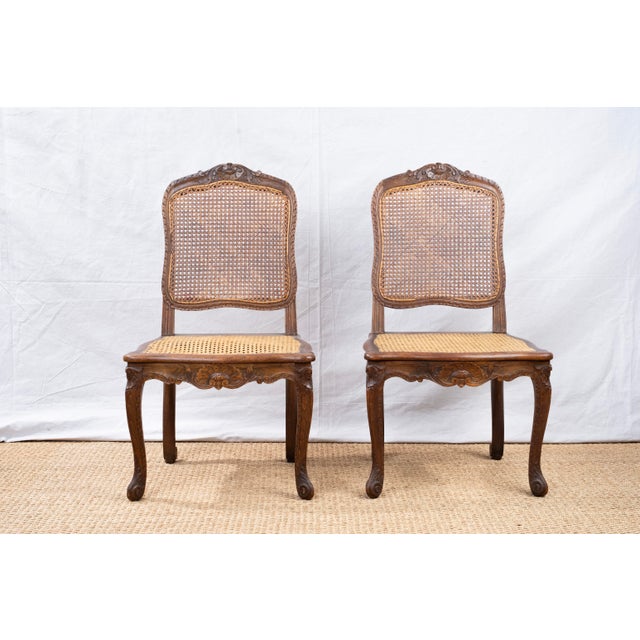 Pair of Louis XV Style side chairs with cane backs and seats, c 1900, French. Featuring original cane seats and backs....