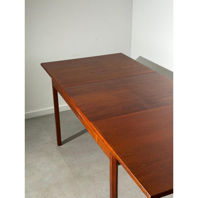 Elegant extendable teak dining table by white & newton , a fine example of british mid-century modern design from the...