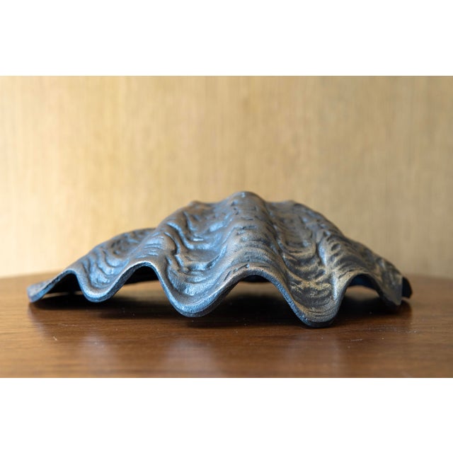 Fantastic vintage decorative clamshell dish crafted from heavy metal. This substantial piece is thick, weighty, and...