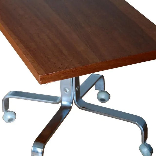- Small auxiliary table from Germany from the 1970s - Table top veneered - Table construction is made of chromium-plated...