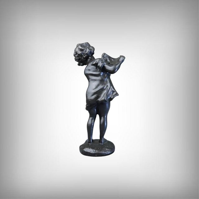 This small bronze sculpture, titled "Cuckoo" and signed Rosa Bonheur, exudes the charm of a childhood scene captured in a...