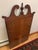Antique Georgian Chippendale-style mirror that would look stylish hanging on the wall or over a mantel. Mirror features...