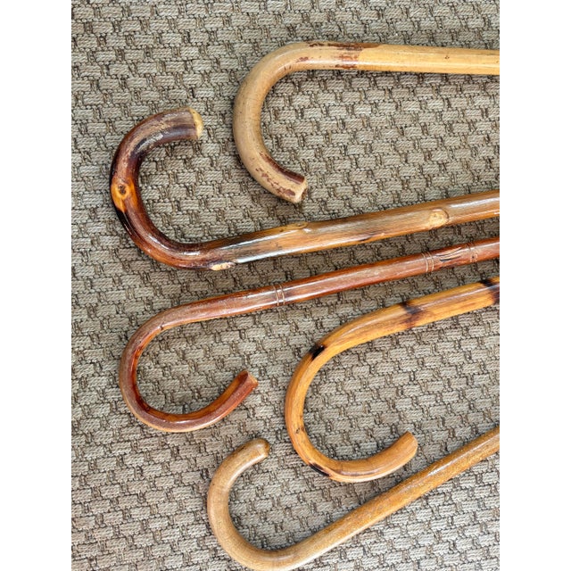 Five vintage cane walking sticks are described as follows: Simple and thin wood cane, 32” tall, is light, but strong....