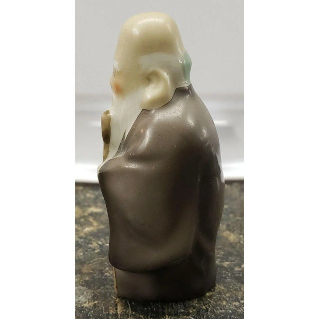 This 2016 Japanese Arita Porcelain Jurojin Figurine by Kosuzu Tougei measures 2 1/4" tall.