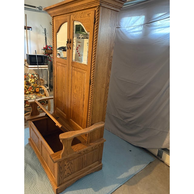 Handsome large Amish style traditional oak hall tree bench with built in storage under the seat and door that opens to...