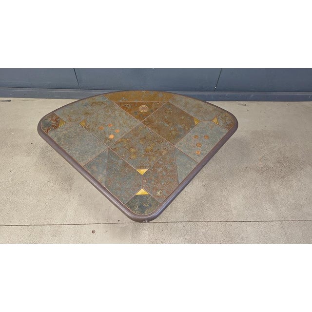 Brutalist slate and natural stone top coffee table with inlaid copper and brass. Stone base. Good condition. Very much in...