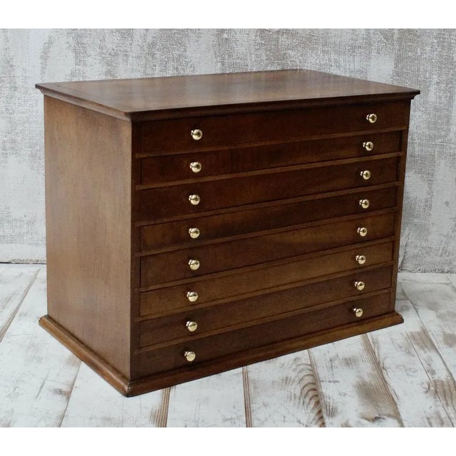 An original set of French apothecary drawers. Made from Walnut, with 8 pull out drawers, with sectioned inserts for plant...