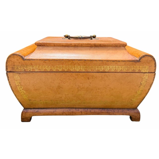 Vintage leather decorative box with a distinctive architectural form, rolled sides, and gilt tooled borders. The hinged...